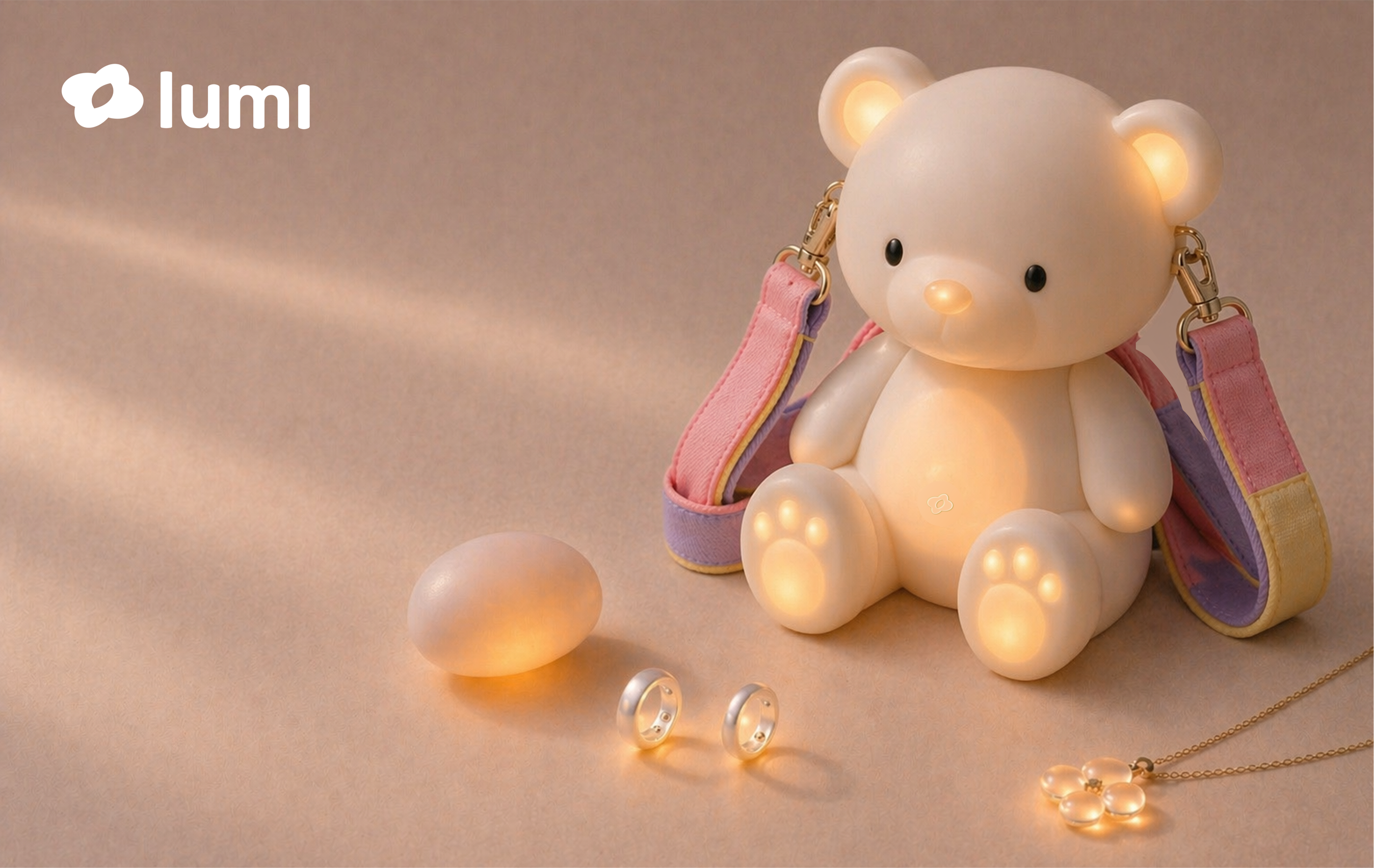 Lumi ecosystem diagram connecting Ring, Hold, Necklace, Bear and app as one support family